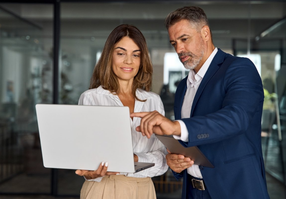 Two professionals looking at laptop